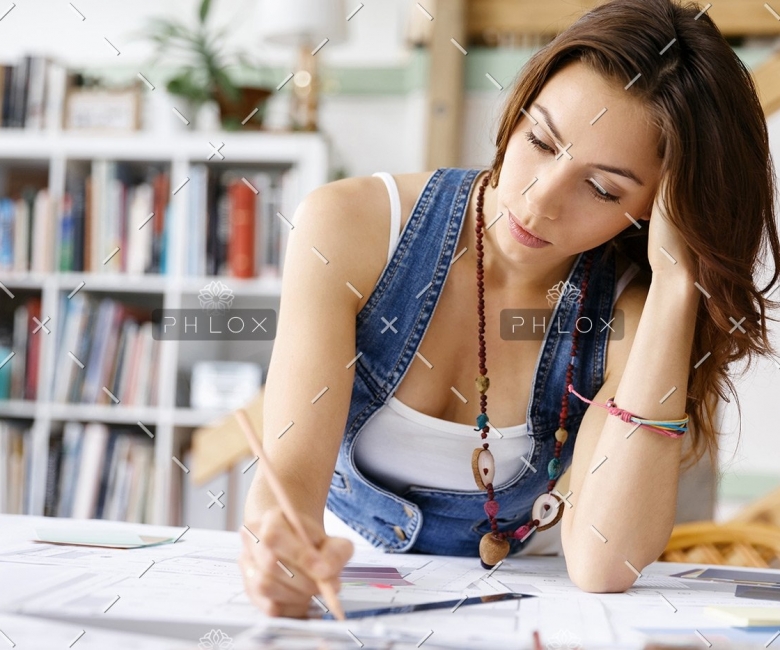 demo-attachment-137-young-pretty-woman-at-her-desk-PDDLFRL